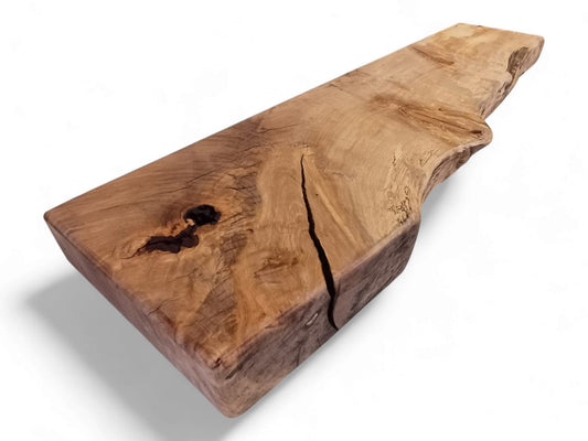 A live edge spalted beech wood mantle piece with a natural rustic finish.